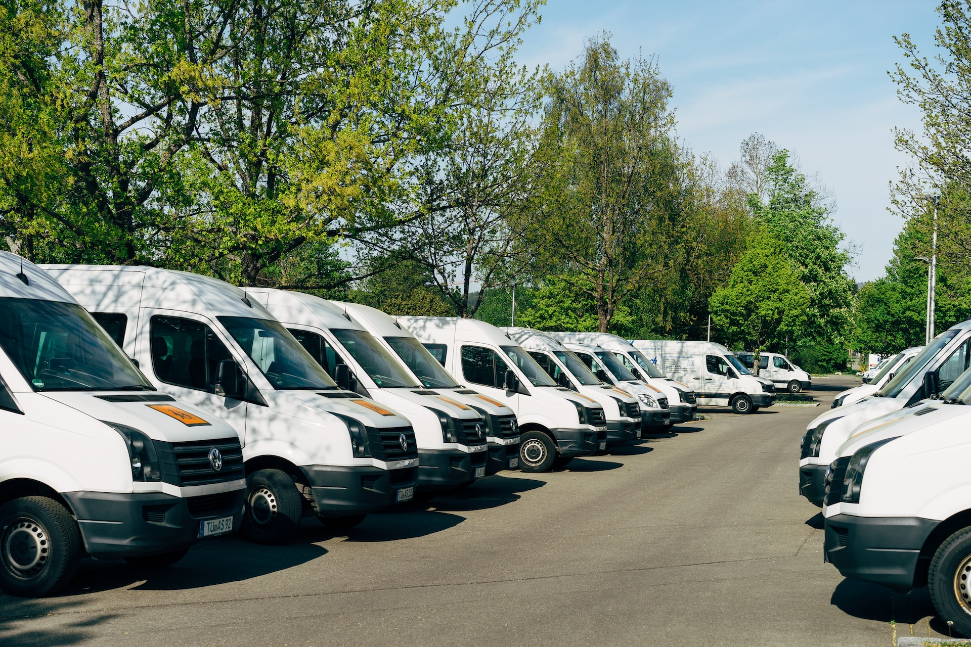 Vans parked in parking lot during daytime